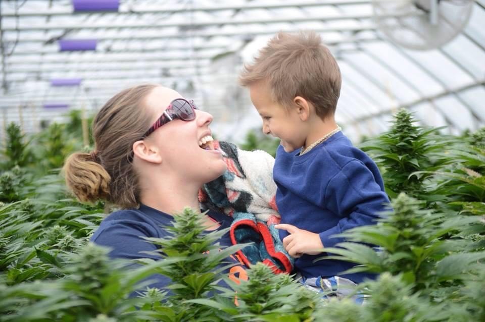 photo of landon riddle and mom in cannabis greenhouse