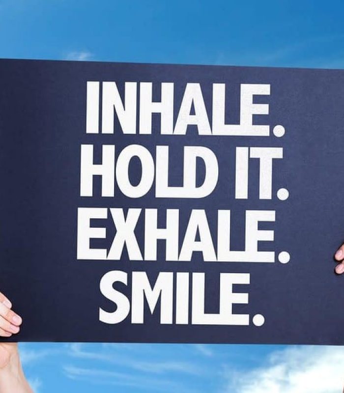 Sign that reads: inhale. hold it. exhale. smile