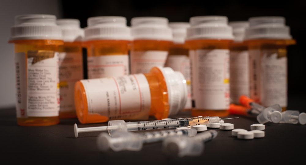 Opioid pill bottles and spilled pain meds