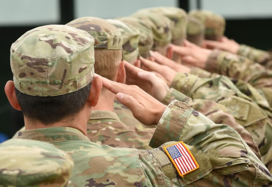 VA cannabis policy represented by Close up of line of American Soldiers saluting, VA