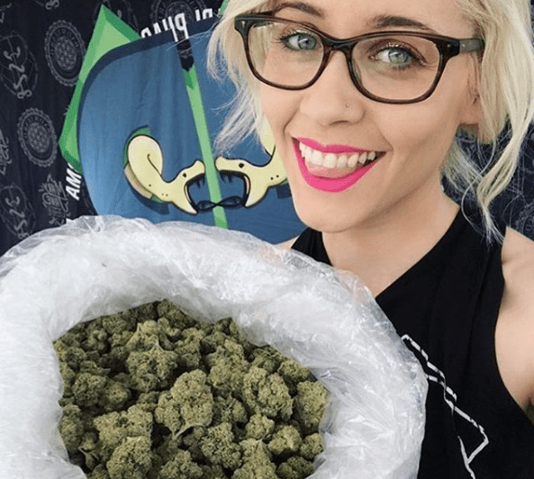 Alice Moon Cannabis Advocate and Party Planner Holding Bag of Cannabis