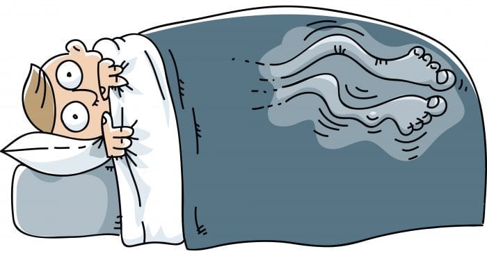 cartoon of man in bed with restless leg syndrome