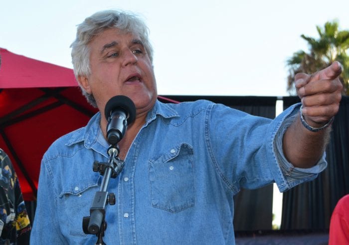 Jay Leno speaking at a podium about his hemp car
