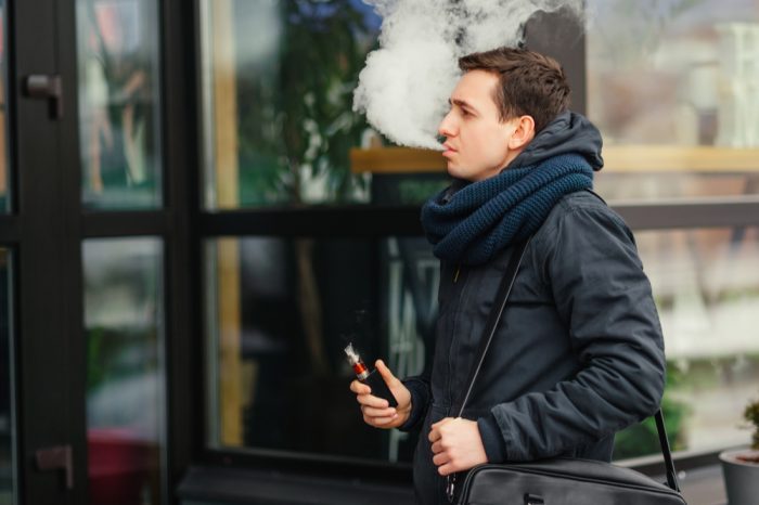 man on street representing vaping second hand smoke