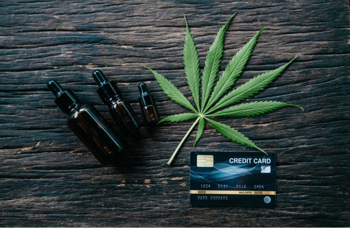 cannabis credit card next to cannabis oil