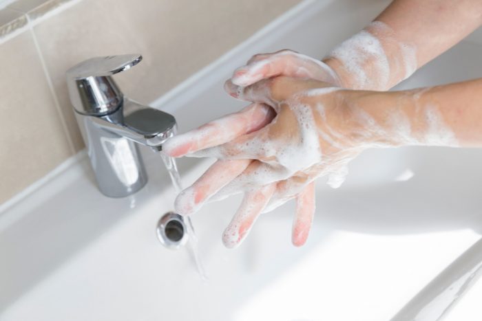 person with ocd washing hands