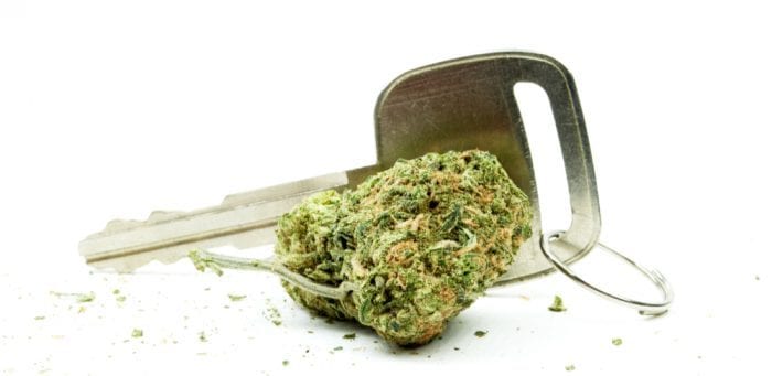 cannabis bud next to keys