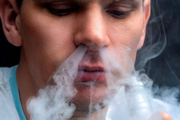 man vaping despite fact that it maybe can kill you