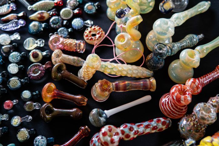 assorted pipes made by blowing glass
