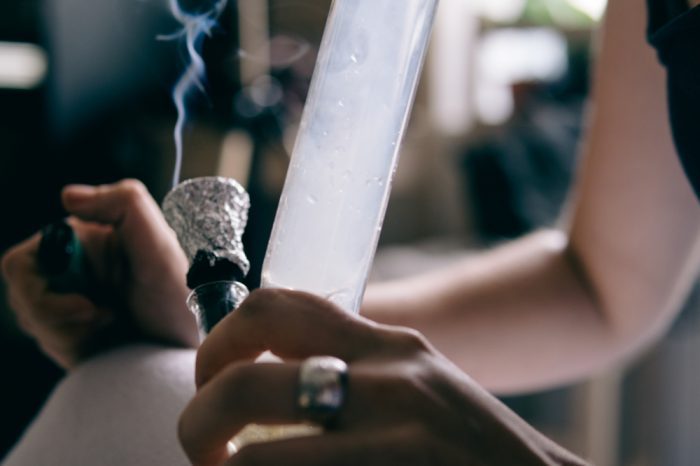 cannabis abuse disorder might look like this girl smoking from a bong