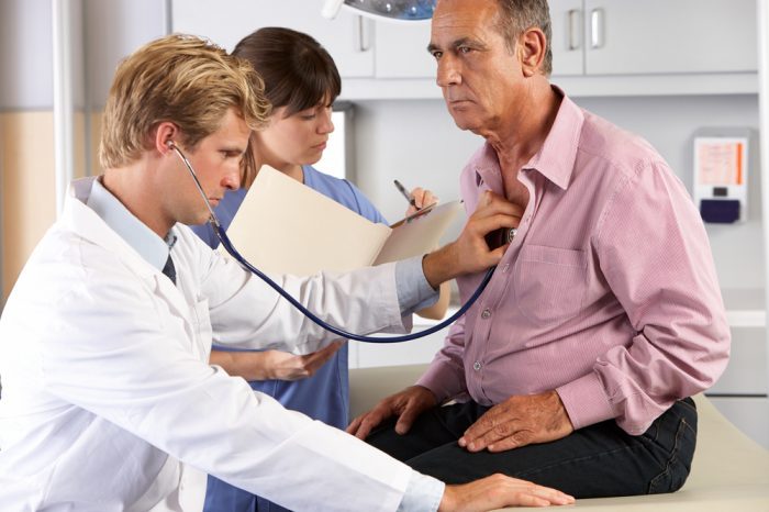 copd diagnosis in progress as doctor puts stethoscope to patients chest