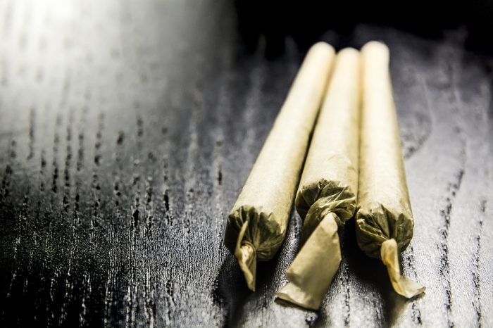 Therapeutic Potential of Cannabis and Cannabinoids represented by well rolled joints