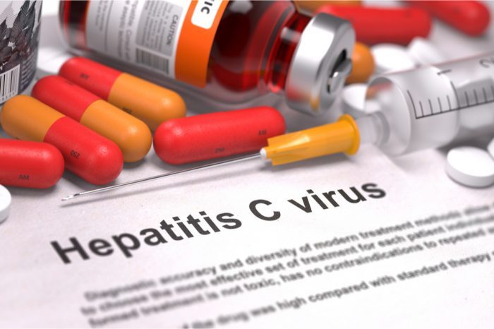 hepatitis c concept represented by medical notes and pill bottles