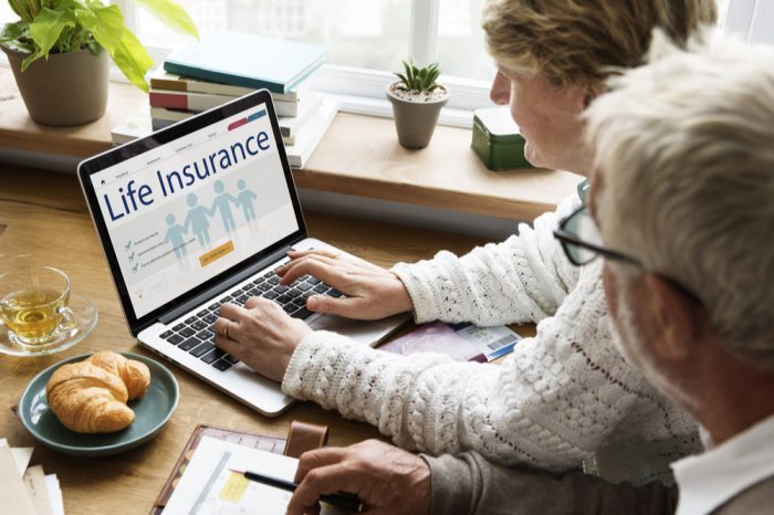 non smoker life insurance represented by older woman shopping online