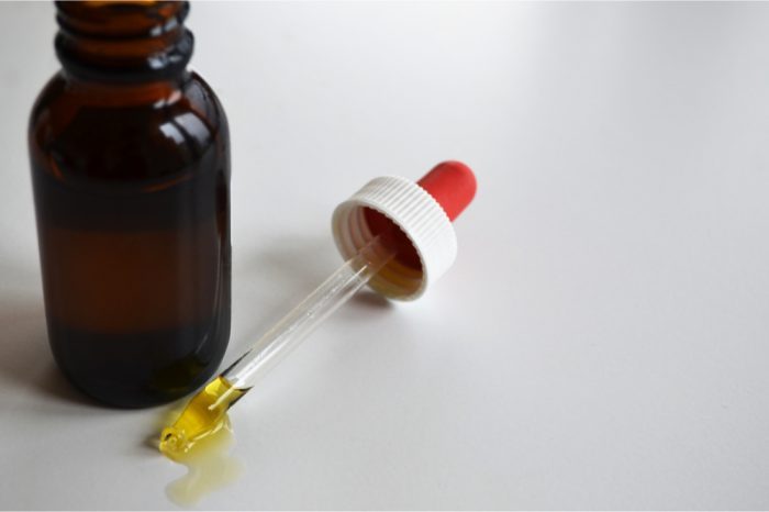can cbd oil cause nightmares represented by bottle and dropper of cbd