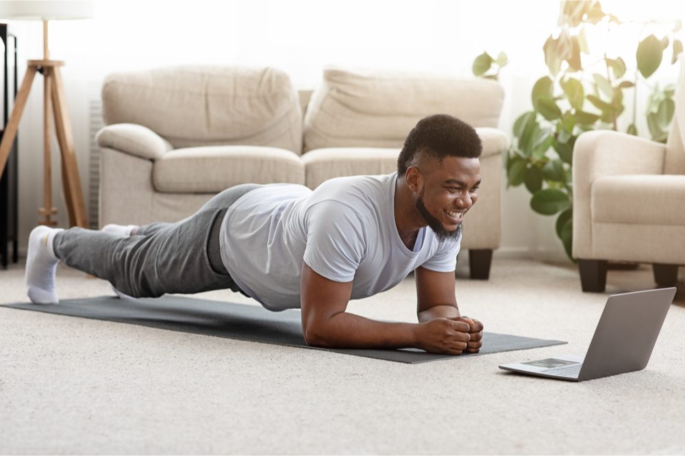 slimming down with cbd represented by young black male planking on mat