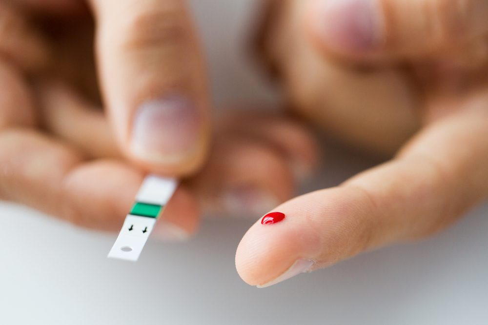 medication for diabetes represented by finger prick blood test